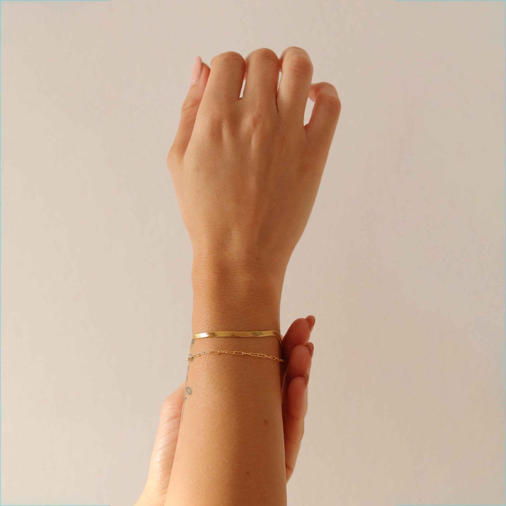 Model wearing LucyKitty Gold Filled Mira Fine Herringbone Bracelet