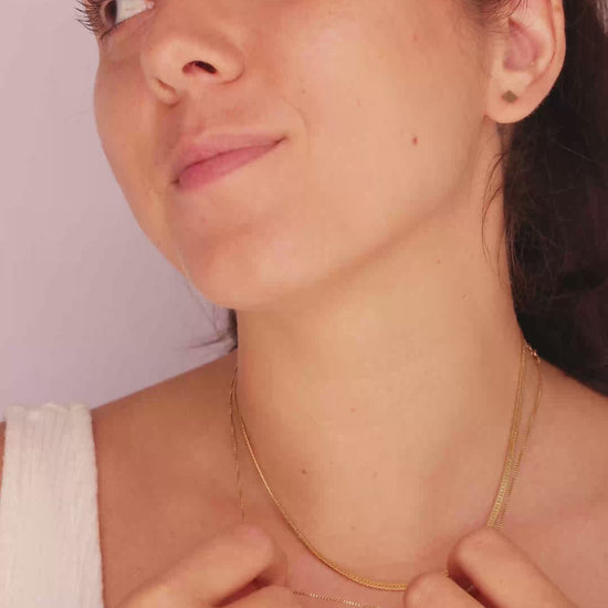 Model wearing the LucyKitty Gold Filled Square Studs and Mira Herringbone Necklace